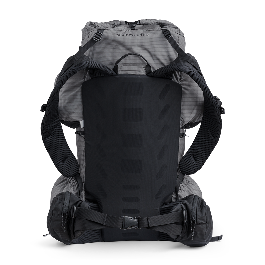 Rear view of the Shadowlight 60 ultralight backpack highlighting the ventilated back panel, shoulder straps, and padded hip belt.