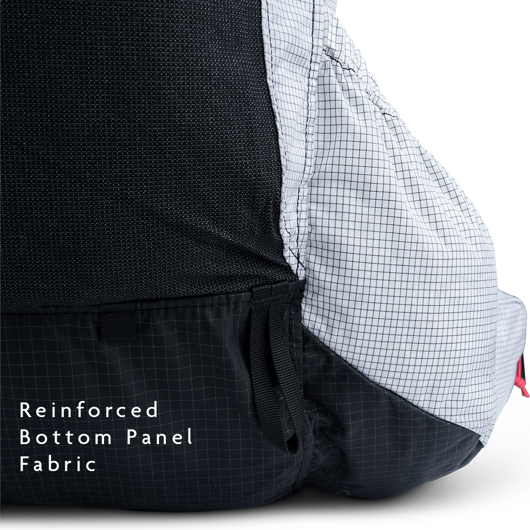 Close-up of backpack reinforced bottom panel fabric for abrasion resistance.