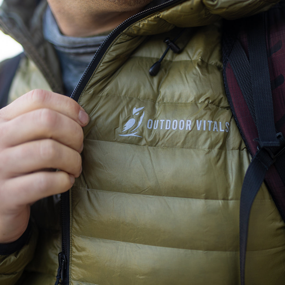 Close-up of the brand text logo on the chest of a NovaUL down jacket.