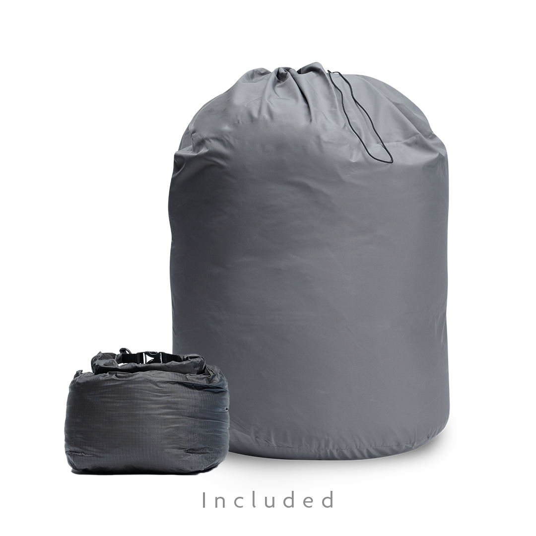 Two storage bags for a backpacking quilt: a large drawstring long-term storage sack and a smaller compressible stuff sack.