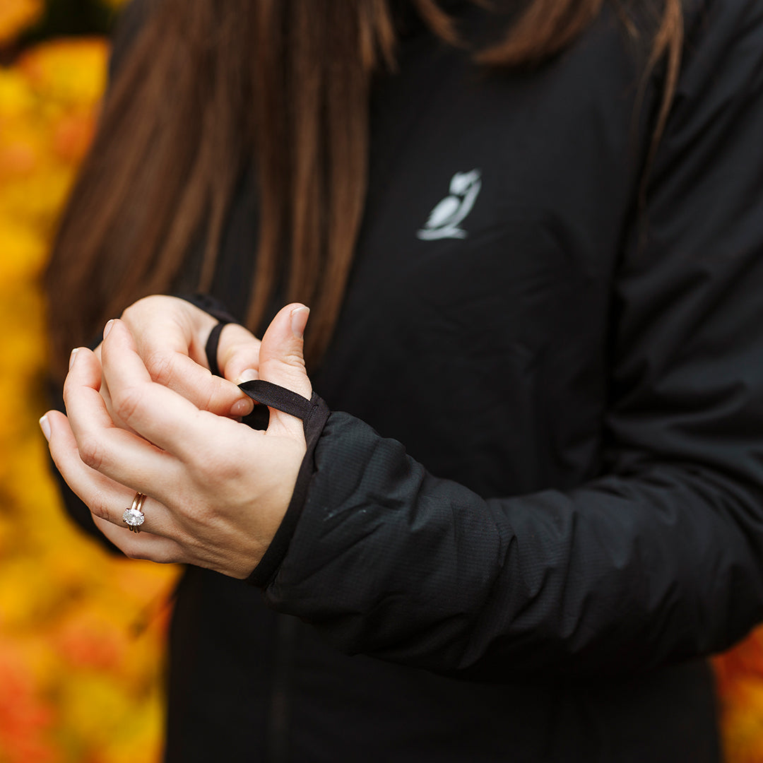 Thumb loops on woman's hands