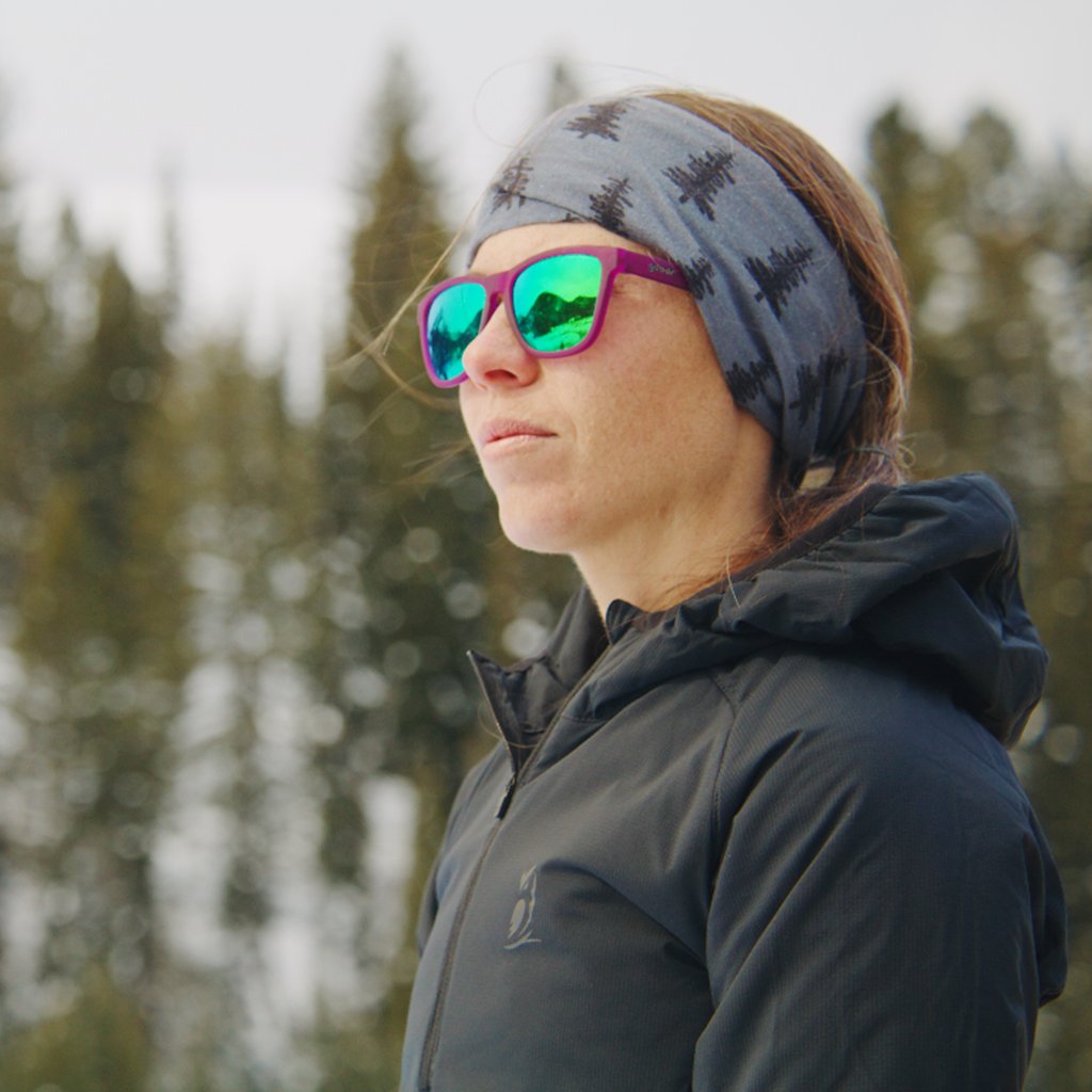 woman looking to the side outdoors while wearing a Ventus Active Hoodie