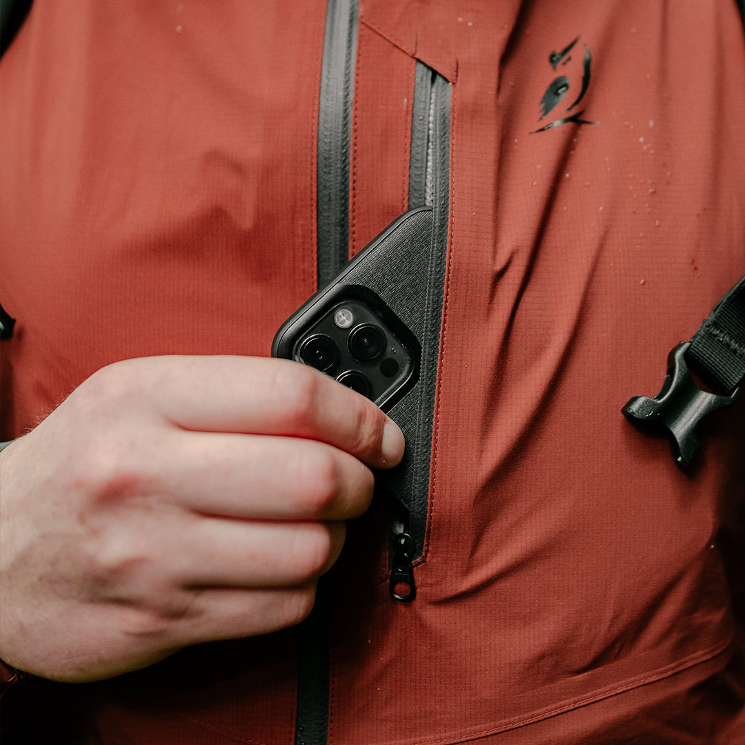 Close-up view of the zippered chest pocket of the ultralight rain jacket