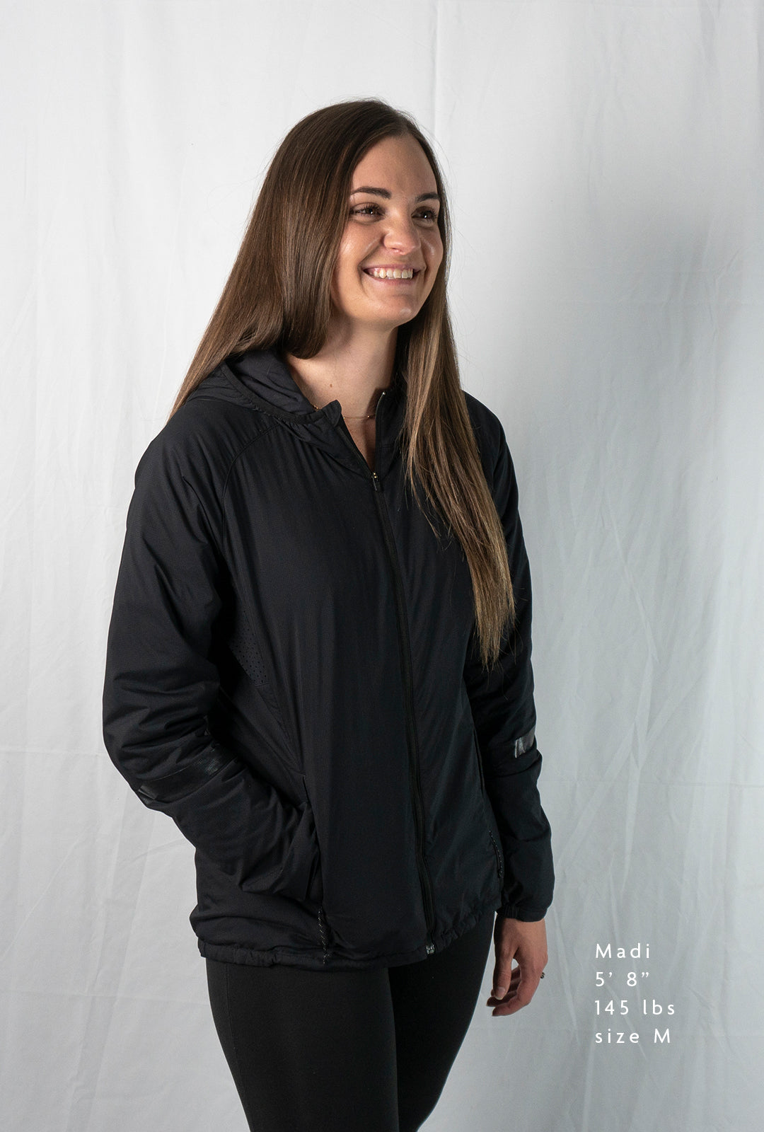 Woman wearing a full zipped hoodie jacket 45 degree angle front view