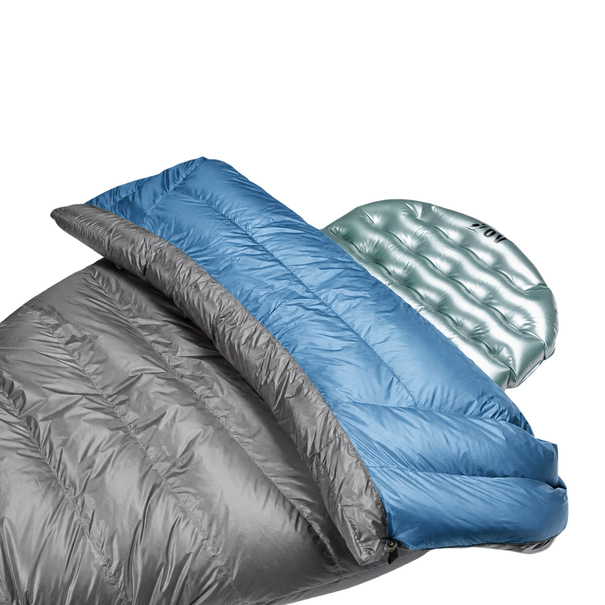 Close-up view of the blue Outdoor Vitals StormLoft Down TopQuilt pulled down to reveal its soft inner lining, paired with an inflatable sleeping pad setup.