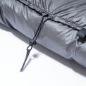 Close-up view of the adjustable drawstring cord lock on the top neck collar of the Outdoor Vitals StormLoft Down TopQuilt.