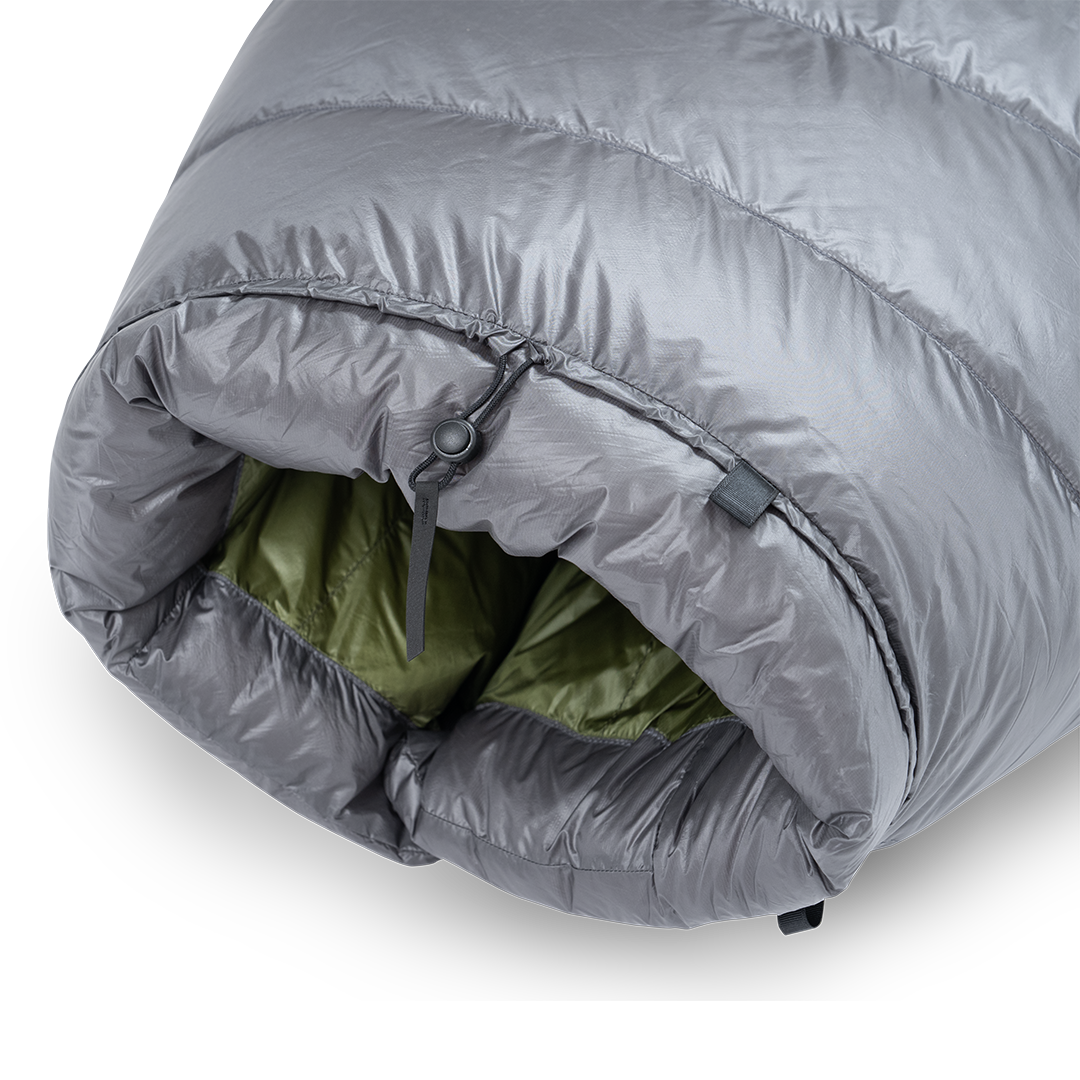 Detailed view of the cinched top neck collar with adjustable cord lock and insulated draft baffle on the Outdoor Vitals StormLoft Down TopQuilt.