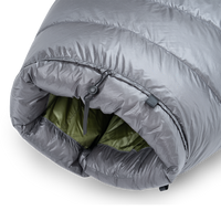 Detailed view of the cinched top neck collar with adjustable cord lock and insulated draft baffle on the Outdoor Vitals StormLoft Down TopQuilt.