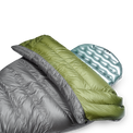 Close-up view of the Outdoor Vitals StormLoft Down TopQuilt pulled down to reveal its soft inner lining, paired with an inflatable sleeping pad setup.