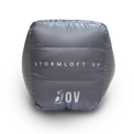 Bottom view of the Outdoor Vitals StormLoft 0F topquilt packed inside its compression stuff sack, displaying the printed product name and OV owl logo.