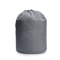 Outdoor Vitals StormLoft Down TopQuilt uncompressed and stored inside its breathable fabric storage sack with a cinch drawstring closure.
