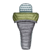 Top-down view of a backpacking quilt partially open, shown with a silvery inflatable sleeping pad inside.