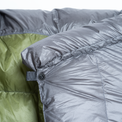 Close-up view of the top snap closure and draft collar on the Outdoor Vitals StormLoft Down TopQuilt.