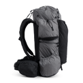 Side view of the Outdoor Vitals Shadowlight backpack showing large side pockets, hip belt pocket, and streamlined suspension system.
