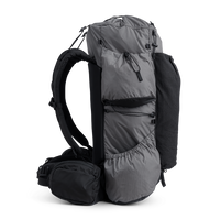 Side view of the Outdoor Vitals Shadowlight backpack showing large side pockets, hip belt pocket, and streamlined suspension system.