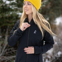 Woman wearing full zip hooded jacket for backpacking on winter