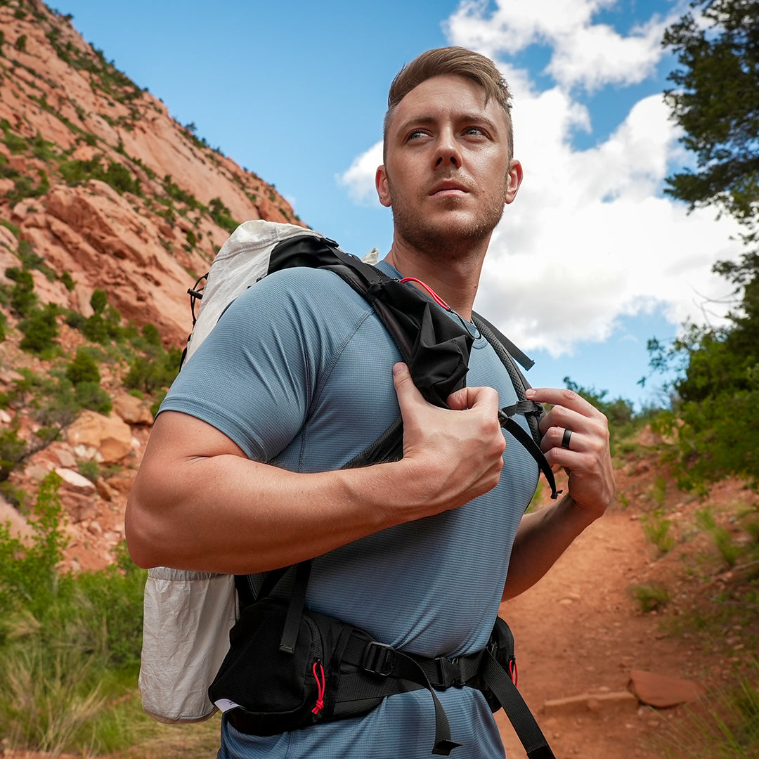 Backpacker wearing athletic shirt