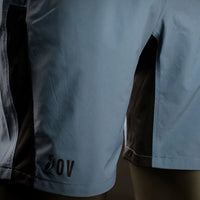Detailed macro shot of Outdoor Vitals Skyline Trail Shorts showing the OV logo, crotch and side ventilation panel.