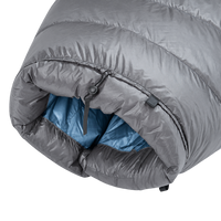 Detailed view of the cinched top neck collar with adjustable cord lock and insulated draft baffle on the blue Outdoor Vitals StormLoft Down TopQuilt.