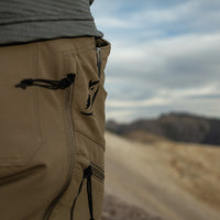 close side view of logo and pockets on men's hiking pants