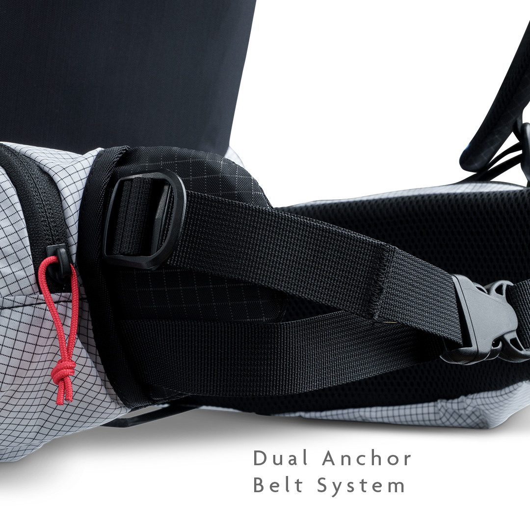 Close-up of backpack hip belt showing dual anchor belt system for improved load transfer.