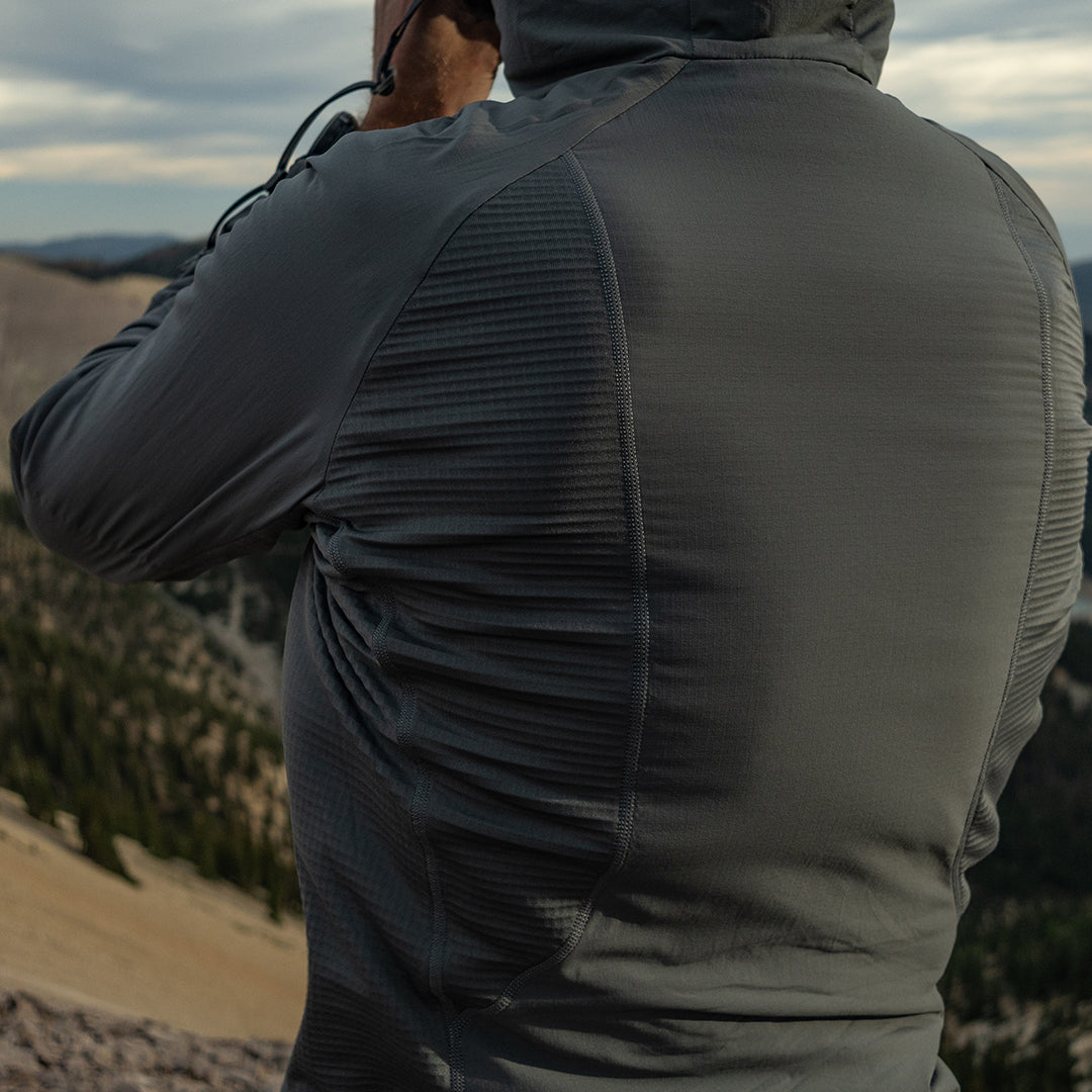 close rear view of hybrid fleece hoodie on man 