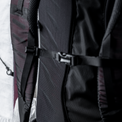 Close-up view of the sternum strap buckled across the back panel and shoulder harness of the Outdoor Vitals CS40 Ultra Backpack.