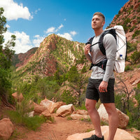 Backpacker wearing long-sleeve athletic shirt