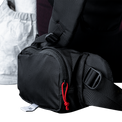 Close-up view of the Outdoor Vitals CS40 Ultra Backpack hip belt pocket, showing the zippered main compartment, cord zipper pull, and adjustable webbing strap.