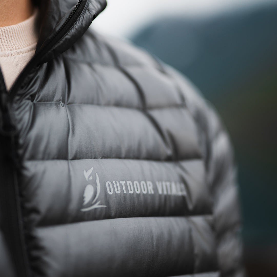 Close-up of the brand text logo on the chest of a NovaUL ultralight down jacket.