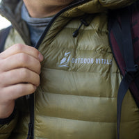 Close-up of the brand text logo on the chest of a NovaUL down jacket.
