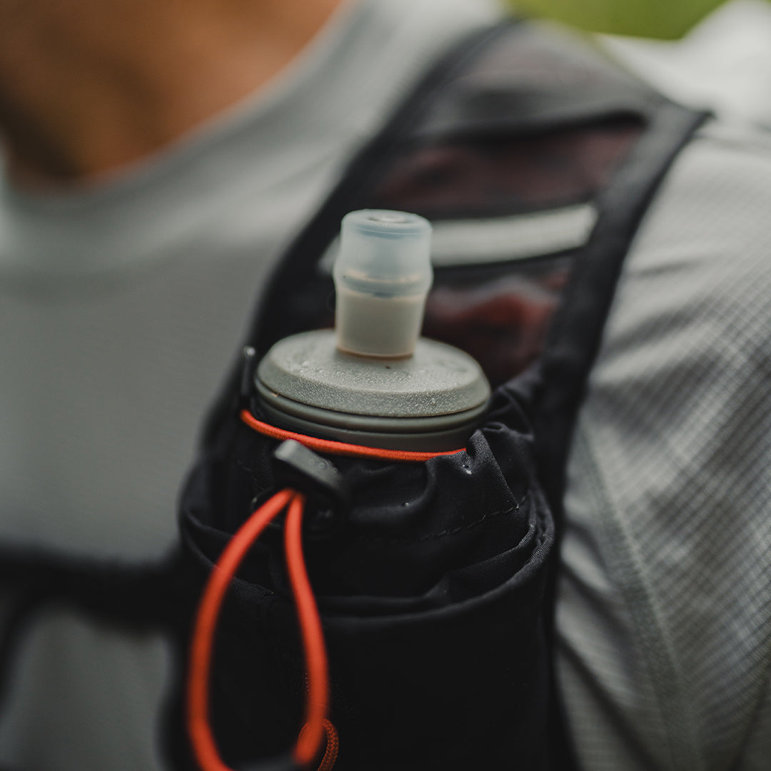 Close-up of a soft water flask in the Outdoor Vitals Skyline 30 Fastpack shoulder strap pocket.