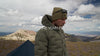 ultralight down jacket shown on high mountain ridge throughout video