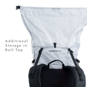 Backpack roll-top closure expanded to show additional storage capacity.