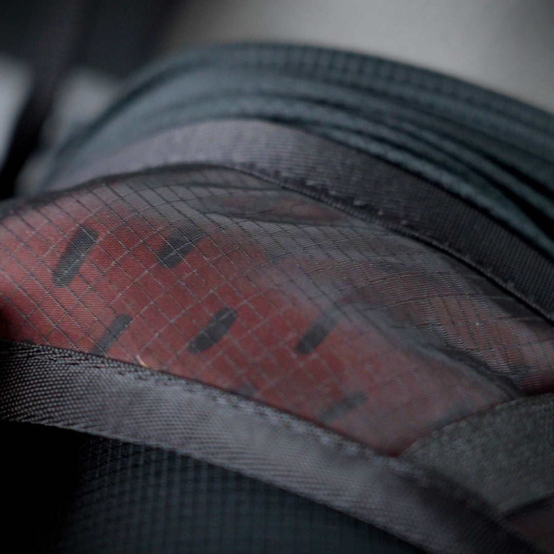Macro detail of ripstop fabric and stitching on the Outdoor Vitals Skyline 30 Fastpack.