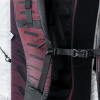 Close-up view of the Outdoor Vitals CS40 Ultra Backpack padded shoulder strap, highlighting the adjustable sternum strap buckle and webbing attachment loops.