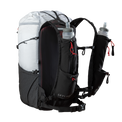 Studio product shot of the Outdoor Vitals Skyline 30 Fastpack featuring its running vest-style shoulder harness, dual adjustable sternum straps, lower webbing hip belt, and integrated harness pockets holding two soft water flasks.