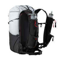 Studio product shot of the Outdoor Vitals Skyline 30 Fastpack featuring its running vest-style shoulder harness, dual adjustable sternum straps, lower webbing hip belt, and integrated harness pockets holding two soft water flasks.
