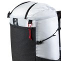 Close-up product detail of the Outdoor Vitals Skyline 30 Fastpack top section, highlighting the roll-top closure strap, brand logo patch, mesh front pocket trim, and side compression cord adjustment system.