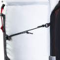 Extreme close-up of the side compression system on the Outdoor Vitals Skyline 30 Fastpack, showing the thin cordage, attachment point loop, and cord lock mechanism.