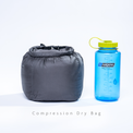 Outdoor Vitals compression dry bag shown next to a water bottle for size comparison.