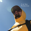 Yellow - Man wearing a sun hoodie against a blue sky