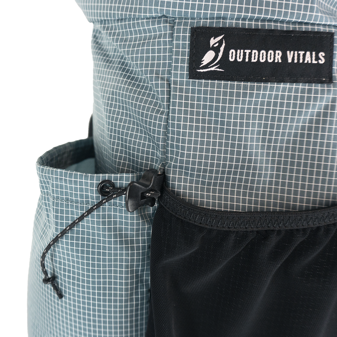 Detail of the Shadowlight Ultralight Backpack's side cinch pocket for secure storage