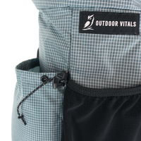 Detail of the Shadowlight Ultralight Backpack's side cinch pocket for secure storage