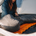 close view of the footbox of a top quilt inside a backpacker's tent