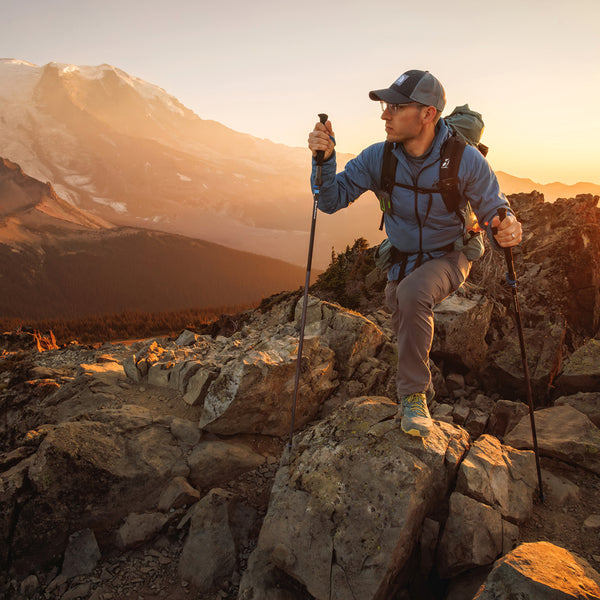 Man wearing full zip hooded jacket for backpacking