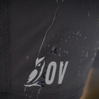 Macro shot of water beading on water-resistant Outdoor Vitals Skyline Trail Shorts with OV logo.
