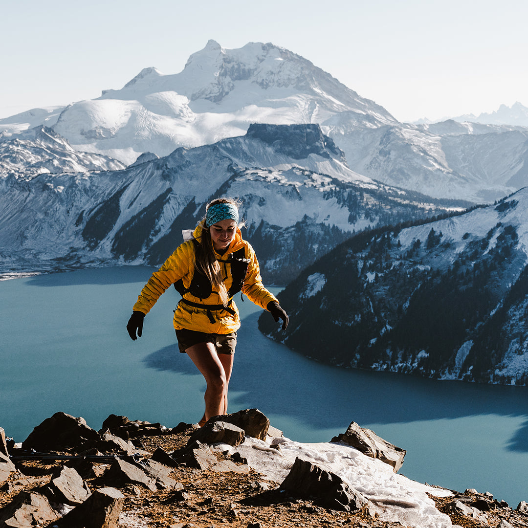 Hiker wearing the Outdoor Vitals Skyline 30 Fastpack along a scenic mountain ridge.