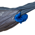 Close-up of the Outdoor Vitals StormLoft Down UnderQuilt draft collar and shock cord cinch system cinched tight around a hammock end.