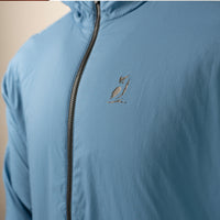 Close-up of the Outdoor Vitals Vario Jacket showing the chest logo and front zipper
